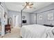 Large bedroom boasts a ceiling fan, ample natural light, and neutral walls and carpet at 2060 Cross Gate Blvd. # 204, Surfside Beach, SC 29575