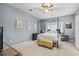 Spacious bedroom featuring a four poster bed, ceiling fan, and bright natural light at 2060 Cross Gate Blvd. # 204, Surfside Beach, SC 29575