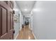 Bright hallway leads to living spaces, featuring hardwood floors and neutral wall colors at 2060 Cross Gate Blvd. # 204, Surfside Beach, SC 29575