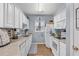 White kitchen with stainless steel appliances and ample cabinet space at 2060 Cross Gate Blvd. # 204, Surfside Beach, SC 29575