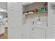 Convenient laundry area features a full size washer and dryer inside a closet at 2060 Cross Gate Blvd. # 204, Surfside Beach, SC 29575
