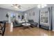 Cozy living room features a comfortable couch, ceiling fan, and view of the outdoor scenery at 2060 Cross Gate Blvd. # 204, Surfside Beach, SC 29575