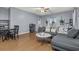 Bright living room with hardwood floors, stylish furnishings, and a ceiling fan at 2060 Cross Gate Blvd. # 204, Surfside Beach, SC 29575