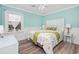 Bedroom with beach-themed bedding and a ceiling fan at 21 Pine Valley Ln., Surfside Beach, SC 29575