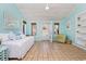 Sunroom with tiled floor, daybed, and built-in shelving at 21 Pine Valley Ln., Surfside Beach, SC 29575