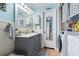 Bathroom with vanity, toilet, and laundry area at 2402 Hillside Dr. S, North Myrtle Beach, SC 29582