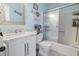Bathroom with white vanity, marble countertop, and shower/tub combo at 2402 Hillside Dr. S, North Myrtle Beach, SC 29582