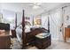Primary bedroom with a king-size bed and access to a private balcony at 2402 Hillside Dr. S, North Myrtle Beach, SC 29582