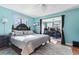 Bright bedroom with a king-size bed and built-in office space at 2402 Hillside Dr. S, North Myrtle Beach, SC 29582
