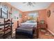 Bedroom with a queen bed, dresser, and beachy decor at 2402 Hillside Dr. S, North Myrtle Beach, SC 29582