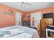 Bedroom with queen bed, dresser, and ceiling fan at 2402 Hillside Dr. S, North Myrtle Beach, SC 29582