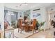 Coastal dining area with wooden table and chairs, near kitchen and access to patio at 2402 Hillside Dr. S, North Myrtle Beach, SC 29582