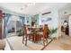 Beachy dining area with wooden table and chairs, and view of patio at 2402 Hillside Dr. S, North Myrtle Beach, SC 29582