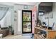 Bright entryway with coral door and view into backyard at 2402 Hillside Dr. S, North Myrtle Beach, SC 29582