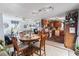 Open kitchen with wooden cabinets and a dining area at 2402 Hillside Dr. S, North Myrtle Beach, SC 29582