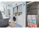 Convenient laundry area with washer, dryer, and storage at 2402 Hillside Dr. S, North Myrtle Beach, SC 29582