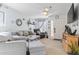 Living room with light blue walls, comfy couches, and a large TV at 2402 Hillside Dr. S, North Myrtle Beach, SC 29582