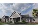 Community clubhouse with front porch and landscaping at 243 Broughton Dr., Myrtle Beach, SC 29579