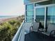 Relax on the balcony with chairs, enjoying serene ocean views and salty air at 2504 Ocean Blvd. N # 232, Myrtle Beach, SC 29577