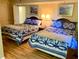 Comfortable bedroom featuring two beds and coordinated blue bedding and decor at 2504 Ocean Blvd. N # 232, Myrtle Beach, SC 29577