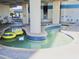 Indoor lazy river with yellow tubes for relaxation and fun in a brightly lit and inviting space at 2504 Ocean Blvd. N # 232, Myrtle Beach, SC 29577