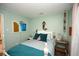 Bedroom with teal bedding and ocean-themed art at 2601 Ye Olde Kings Hwy., North Myrtle Beach, SC 29582