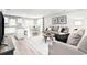 Open concept living room and kitchen with hardwood floors at 3180 Nw Edgemead Circle # B, Calabash, NC 28467