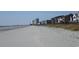 Expansive beachfront property with distant views of buildings and clear, open skies above at 391 Lifestyle Court, Surfside Beach, SC 29575