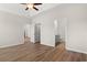 Spacious bedroom with tray ceiling, ceiling fan, and wood-look flooring at 391 Lifestyle Court, Surfside Beach, SC 29575