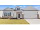 Charming single-Gathering home featuring gray accents, attached garage, and a well-manicured lawn at 391 Lifestyle Court, Surfside Beach, SC 29575
