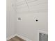 A well-lit laundry room, showcasing hookups for laundry equipment and a wire shelf at 391 Lifestyle Court, Surfside Beach, SC 29575
