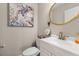 Elegant powder room with a white vanity and gold mirror at 400 Hillside Dr. N # 302C, North Myrtle Beach, SC 29582