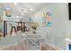 Small dining area with a round table and chairs near the kitchen at 400 Hillside Dr. N # 302C, North Myrtle Beach, SC 29582