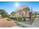 Three-story building with Mediterranean style and palm trees at 400 Hillside Dr. N # 302C, North Myrtle Beach, SC 29582
