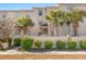 Three-story building with Mediterranean style and palm trees at 400 Hillside Dr. N # 302C, North Myrtle Beach, SC 29582