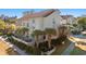 Three-story building with Mediterranean style and palm trees at 400 Hillside Dr. N # 302C, North Myrtle Beach, SC 29582
