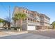 Three-story building with Mediterranean style and palm trees at 400 Hillside Dr. N # 302C, North Myrtle Beach, SC 29582