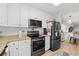 Modern kitchen featuring granite countertops and stainless steel appliances at 400 Hillside Dr. N # 302C, North Myrtle Beach, SC 29582