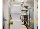 Stackable washer and dryer in a well-lit laundry closet at 400 Hillside Dr. N # 302C, North Myrtle Beach, SC 29582