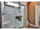 Bathroom shower featuring a glass door, a built-in seat, and a window at 4382 Saint Annes Ct., Myrtle Beach, SC 29579