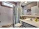 Cozy bathroom with a shower and tub combination, vanity, mirror, and floral shower curtain at 4382 Saint Annes Ct., Myrtle Beach, SC 29579