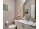 Bathroom boasts a vanity with a large mirror and updated fixtures at 4382 Saint Annes Ct., Myrtle Beach, SC 29579