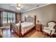 Bedroom with hardwood floors, a ceiling fan, and a decorative bed frame at 4382 Saint Annes Ct., Myrtle Beach, SC 29579