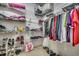 Walk-in closet featuring wire shelving and a variety of hanging and folded clothing items at 4382 Saint Annes Ct., Myrtle Beach, SC 29579