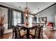 Open dining room with a view to the foyer, complete with decorative lighting and seating for six guests at 4382 Saint Annes Ct., Myrtle Beach, SC 29579