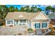 Inviting home exterior features a well-manicured lawn, matching shutters, and a charming entrance at 4382 Saint Annes Ct., Myrtle Beach, SC 29579