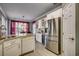 This updated kitchen features stainless steel appliances, granite countertops, and white cabinets at 4382 Saint Annes Ct., Myrtle Beach, SC 29579