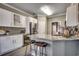 Modern kitchen featuring stainless steel appliances, granite countertops, and a breakfast bar with seating at 4382 Saint Annes Ct., Myrtle Beach, SC 29579