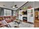 Spacious living room with built-in shelving, a fireplace, and a cozy seating area for entertaining at 4382 Saint Annes Ct., Myrtle Beach, SC 29579