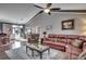Inviting living room with comfortable seating, a ceiling fan, and an open layout ideal for gatherings at 4382 Saint Annes Ct., Myrtle Beach, SC 29579